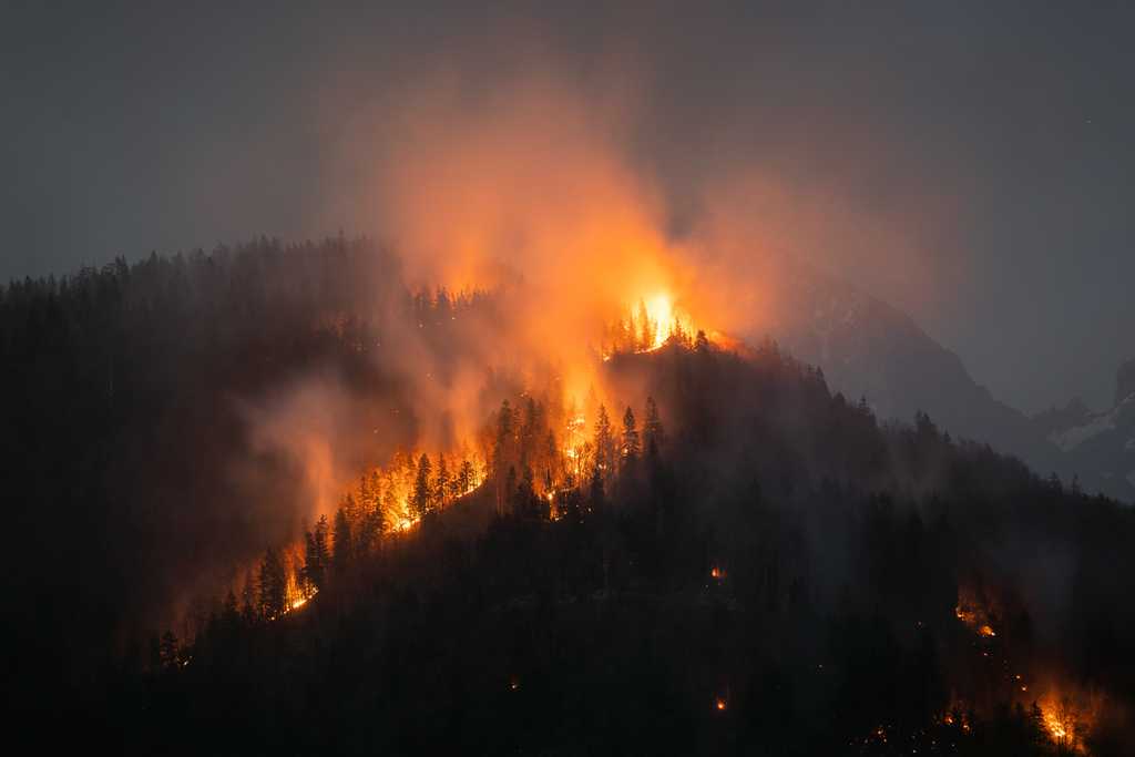 wildfire at night on mountainside