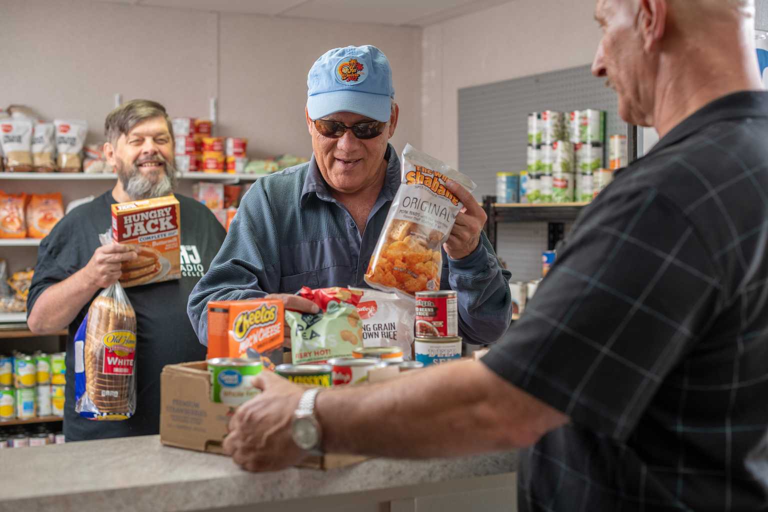 residents buy food at the village on sage