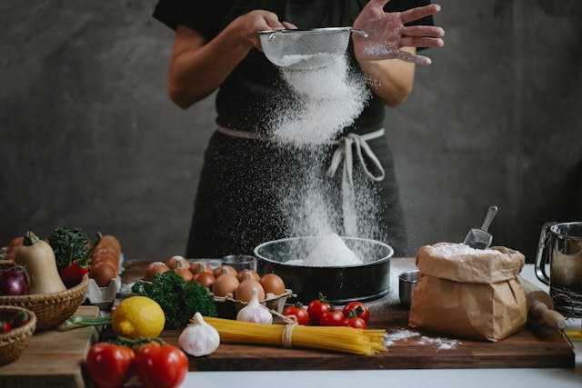 sifting flour in the kitchen